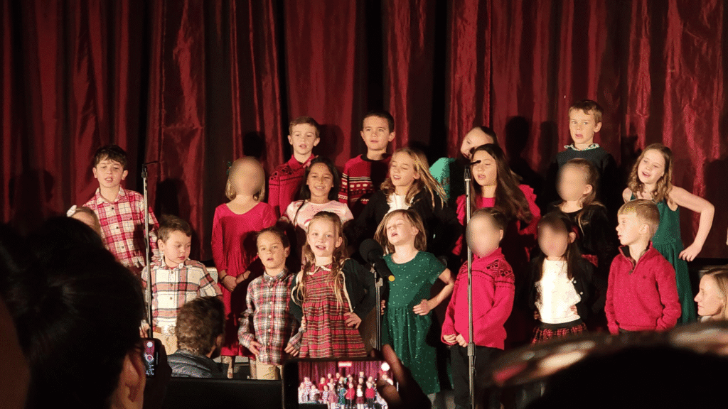 School children performing on stage at El Dorado Adventist School Christmas concert.