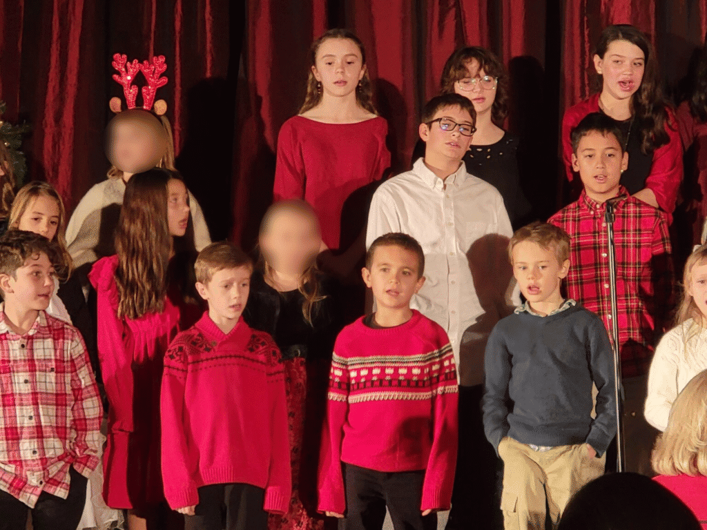 Students singing Christmas carols at El Dorado Adventist School in a holiday celebration.