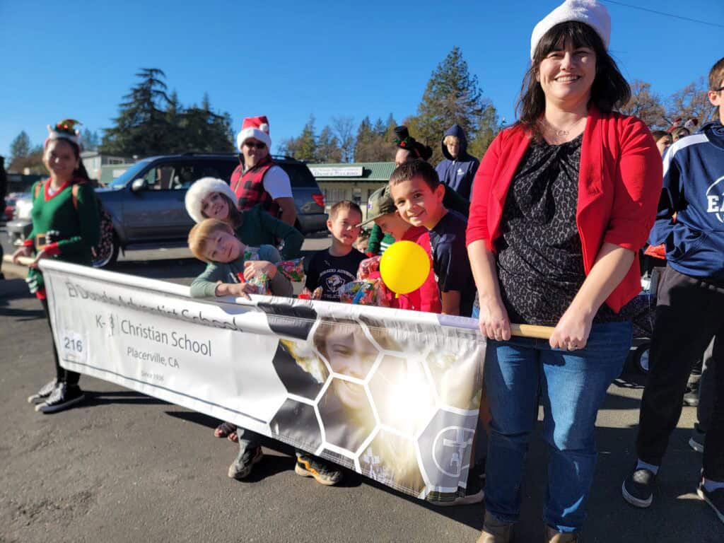 Festive school parade with children and staff celebrating the holiday season at El Dorado Adventist School.