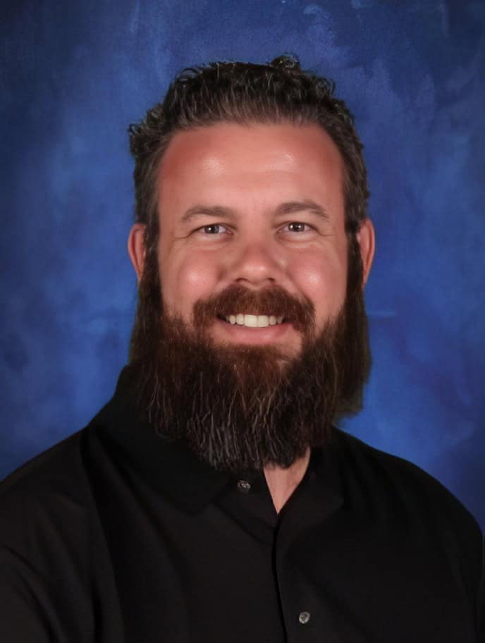 El Dorado Adventist School staff member smiling in professional portrait.