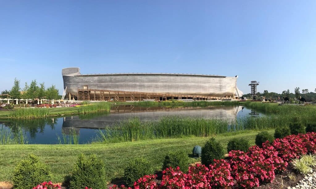Futuristic ship-shaped building at El Dorado Adventist School with lush landscaping and water features.