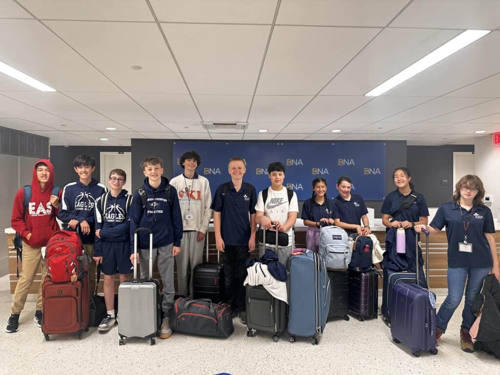 Students with luggage at El Dorado Adventist School, ready for a school trip or event, showcasing a welcoming and diverse school community.