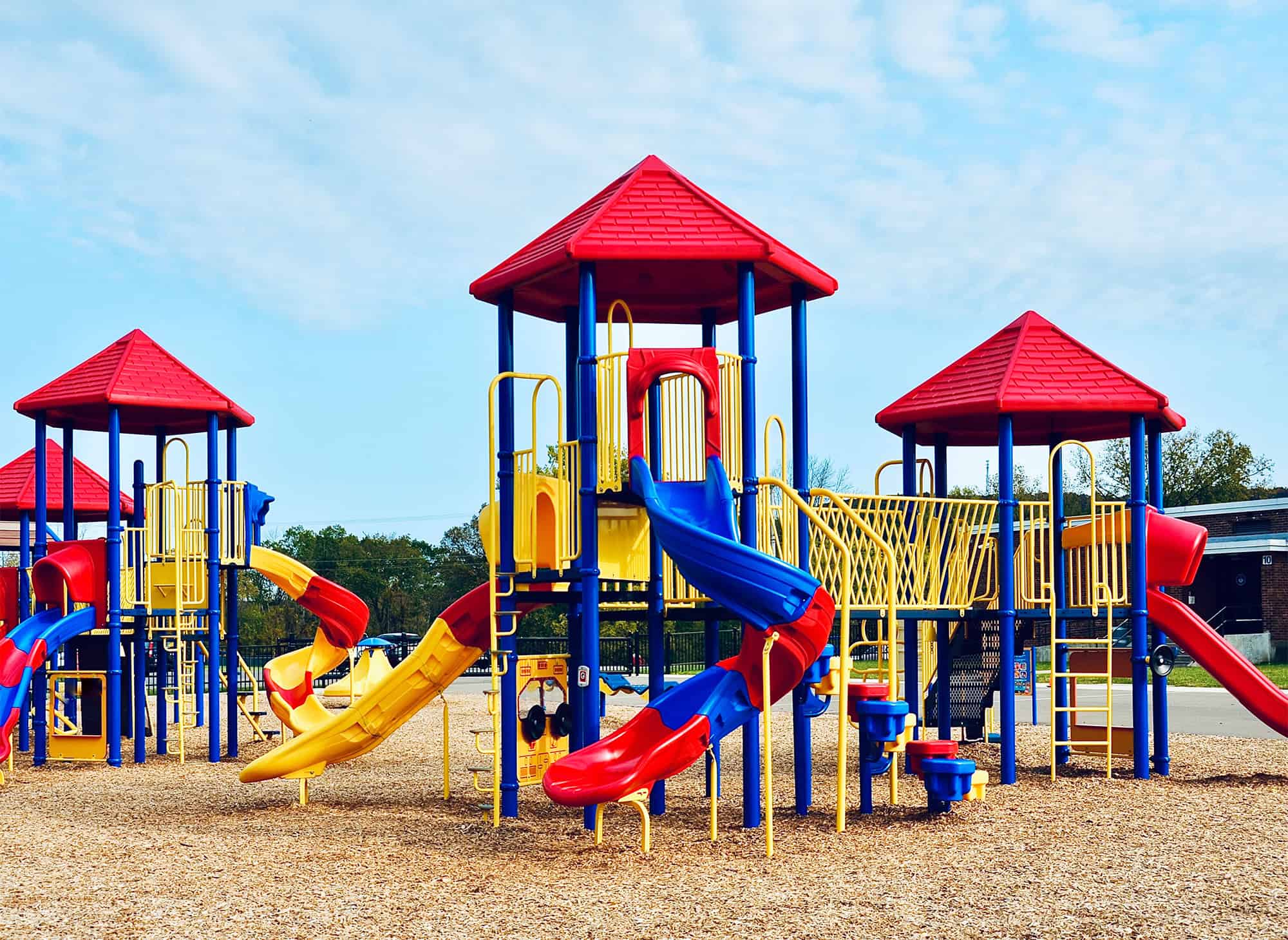 Colorful playground equipment at El Dorado Adventist School outdoor recreation area.