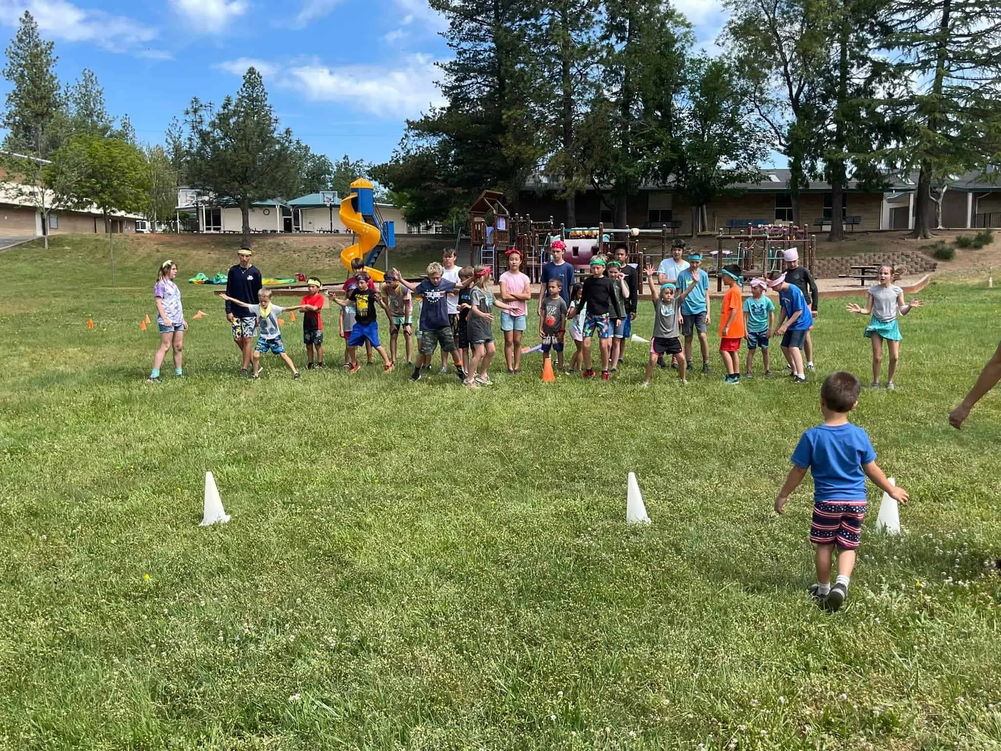 Kids playing outdoor team-building games at El Dorado Adventist School playground.