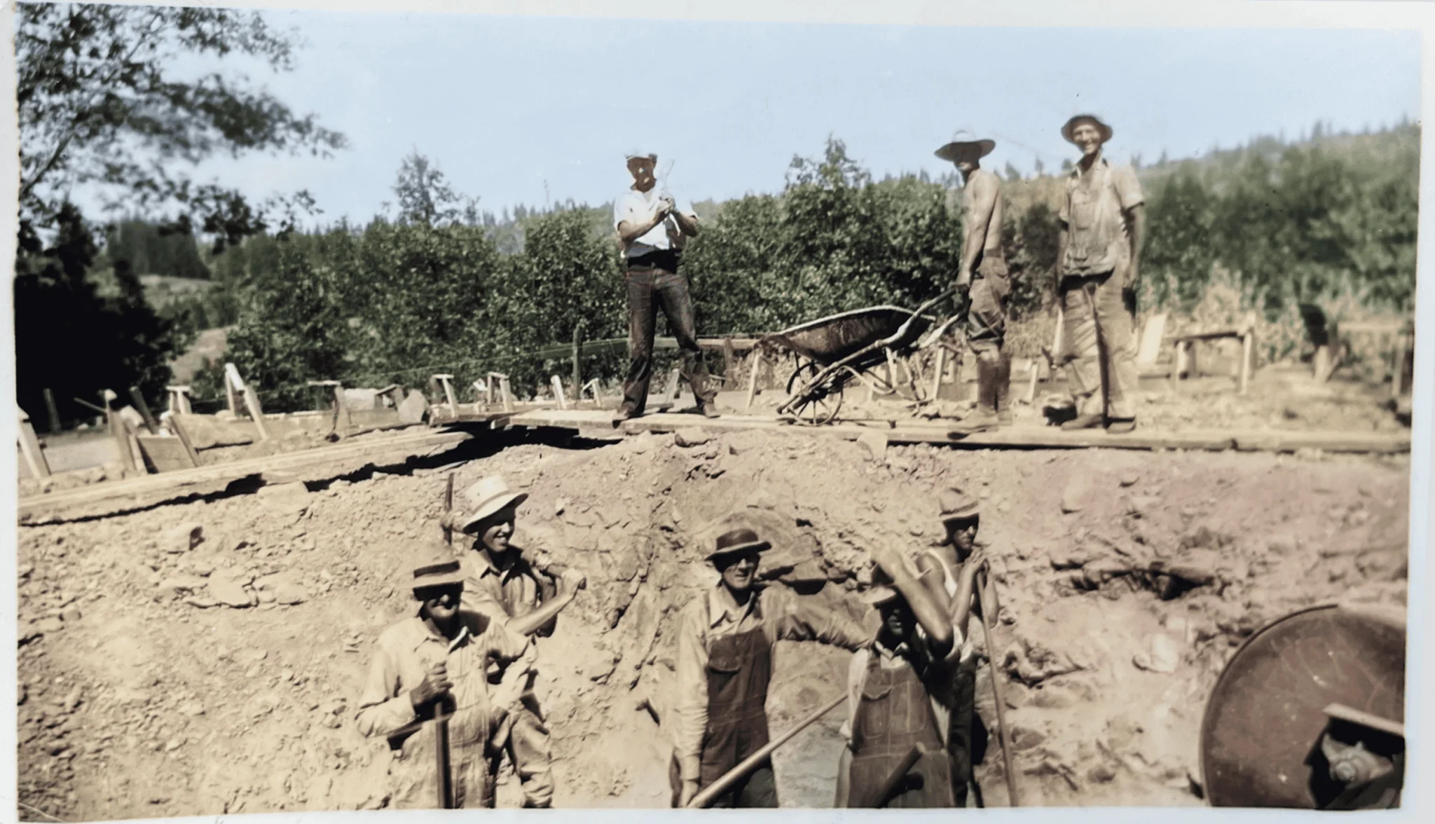 Railroad construction at El Dorado Adventist School, historical photo of workers building a track in a rural setting.